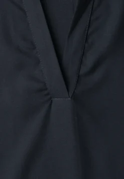Blouse à col chemise et ourlet élastiqué