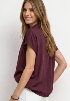 Blouse à col chemise et ourlet élastiqué