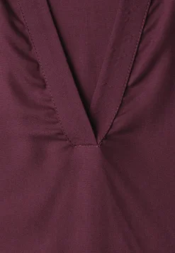 Blouse à col chemise et ourlet élastiqué