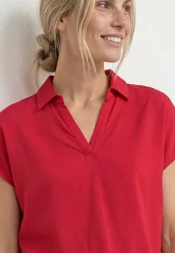 Blouse à col chemise et ourlet élastiqué