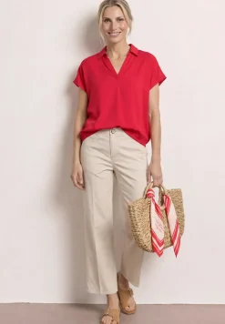 Blouse à col chemise et ourlet élastiqué