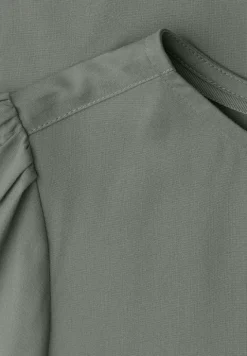Blouse à col rond et manches courtes bouffantes