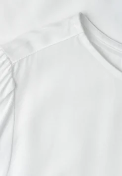 Blouse à col rond et manches courtes bouffantes