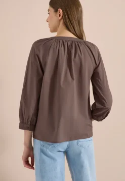 Blouse à manches 3/4 avec col fendu en couleur unie
