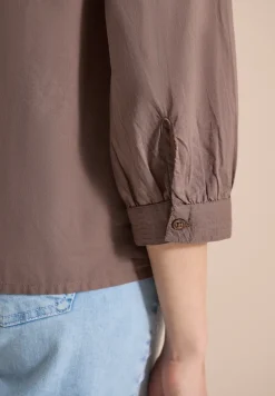 Blouse à manches 3/4 avec col fendu en couleur unie