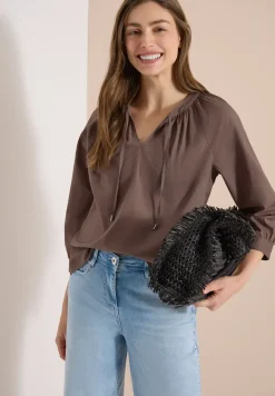 Blouse à manches 3/4 avec col fendu en couleur unie