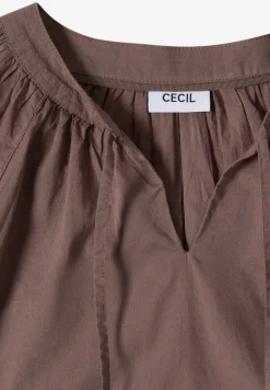 Blouse à manches 3/4 avec col fendu en couleur unie