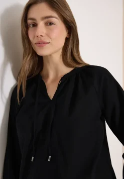 Blouse à manches 3/4 avec col fendu en couleur unie