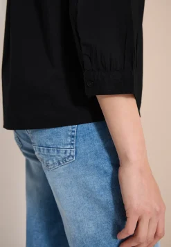 Blouse à manches 3/4 avec col fendu en couleur unie