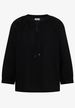 Blouse à manches 3/4 avec col fendu en couleur unie