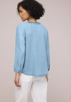 Blouse à manches 3/4 avec col fendu dans un look denim