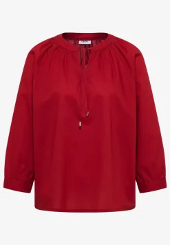 Blouse à manches 3/4 avec col fendu en couleur unie