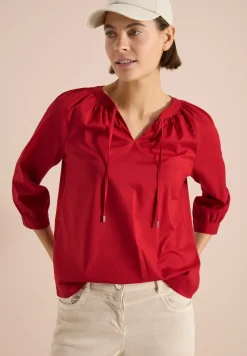 Blouse à manches 3/4 avec col fendu en couleur unie