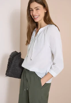 Blouse à manches 3/4 avec col fendu en couleur unie