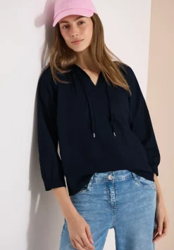 Blouse à manches 3/4 avec col fendu en couleur unie