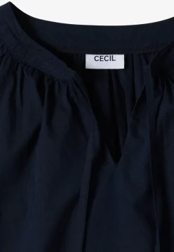 Blouse à manches 3/4 avec col fendu en couleur unie