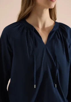 Blouse à manches 3/4 avec col fendu en couleur unie