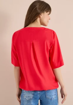 Blouse à manches 3/4 avec col fendu