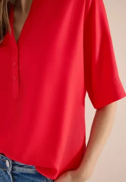 Blouse à manches 3/4 avec col fendu