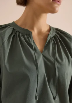 Blouse à manches 3/4 avec col fendu en couleur unie
