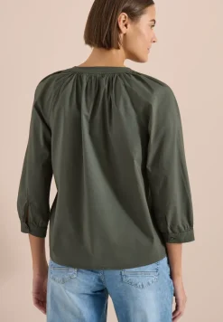 Blouse à manches 3/4 avec col fendu en couleur unie