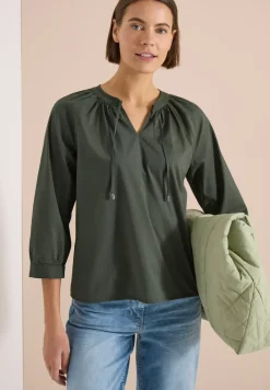 Blouse à manches 3/4 avec col fendu en couleur unie