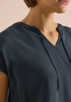 Blouse à manches courtes avec mélange de structures