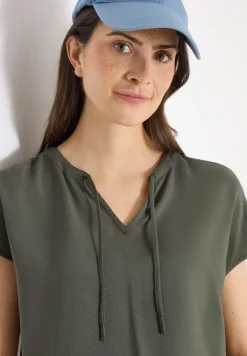 Blouse à manches courtes avec mélange de structures