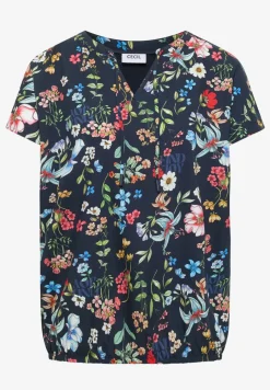 Blouse à manches courtes avec un mélange de structures et un imprimé