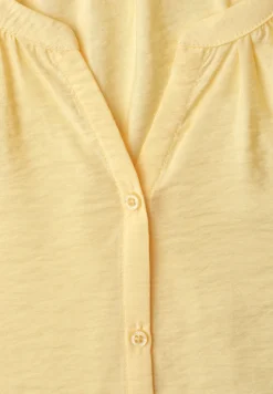 Blouse à manches courtes avec col fendu et boutons