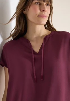 Blouse à manches courtes avec mélange de structures