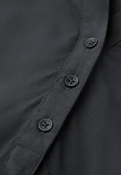 Blouse à manches courtes en couleur unie