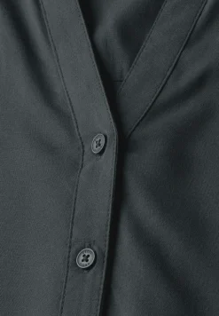 Blouse à manches courtes en couleur unie