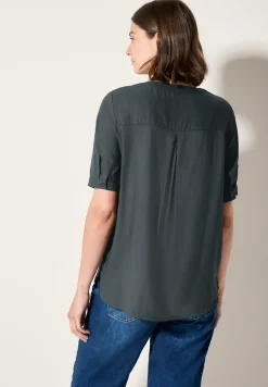 Blouse à manches courtes en couleur unie