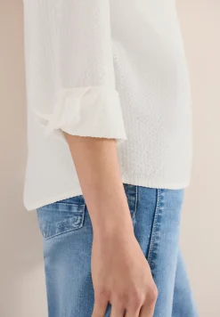 Blouse à manches longues avec structure et boutons