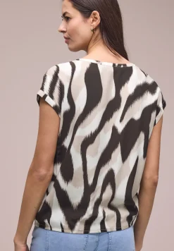 Blouse à épaules tombantes avec bandes décoratifves