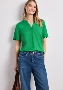 Blouse à épaules tombantes avec col fendu