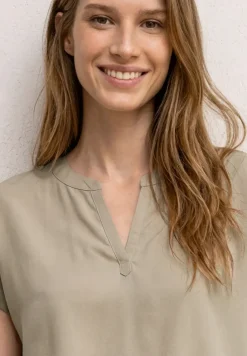 Blouse à épaules tombantes avec col fendu