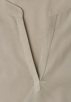 Blouse à épaules tombantes avec col fendu