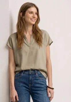 Blouse à épaules tombantes avec col fendu