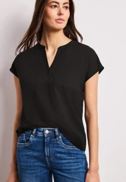 Blouse à épaules tombantes avec col fendu