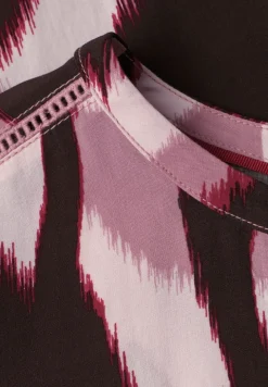 Blouse à épaules tombantes avec bandes décoratifves
