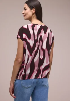 Blouse à épaules tombantes avec bandes décoratifves