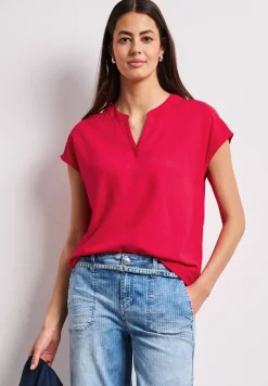 Blouse à épaules tombantes avec col fendu