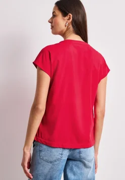 Blouse à épaules tombantes avec col fendu