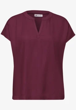 Blouse à épaules tombantes avec col fendu