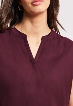 Blouse à épaules tombantes avec col fendu