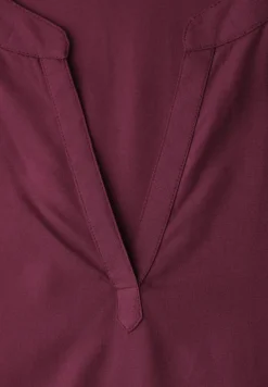 Blouse à épaules tombantes avec col fendu