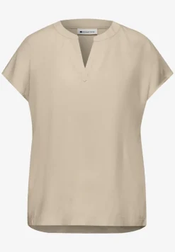 Blouse à épaules tombantes avec col fendu