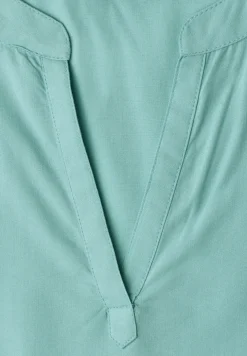 Blouse à épaules tombantes avec col fendu
